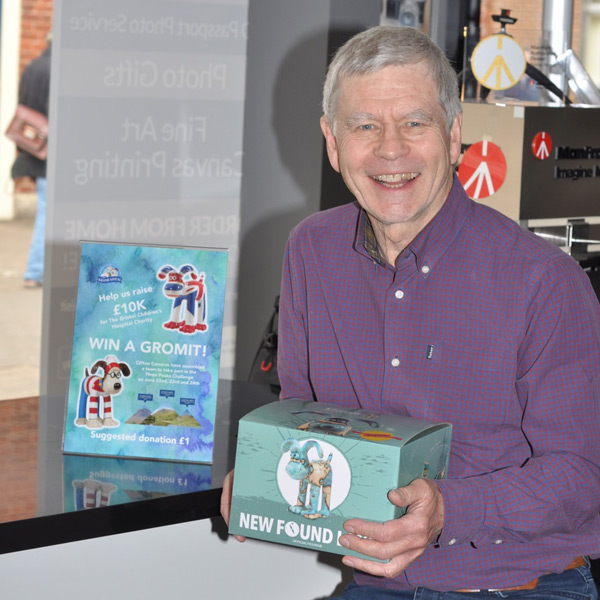 Elderly Gentleman Wins Gromit Figurine as Part of Fundraising Activity at Clifton Cameras