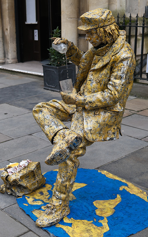 Street performer pouring water