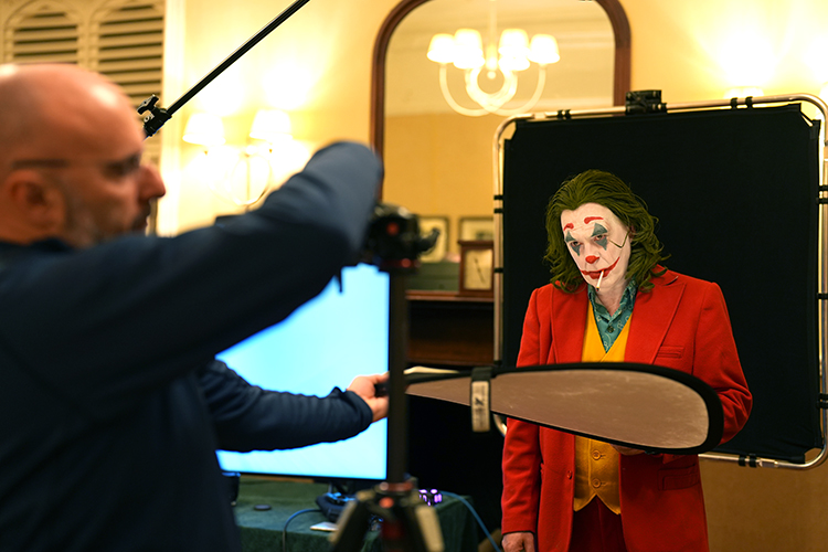 Model dressed as Joker being photographed with a Sony a7 IV