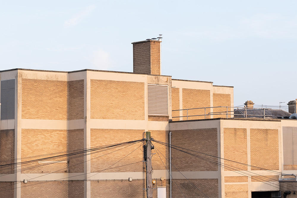 Image of building against blue sky at golden hour