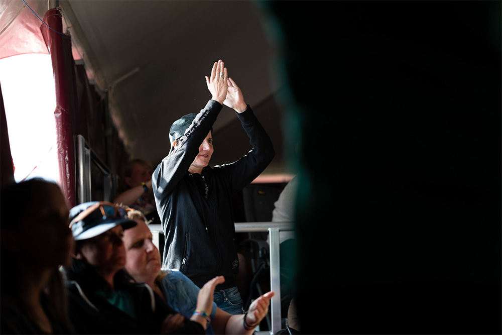 Person clapping at a festival