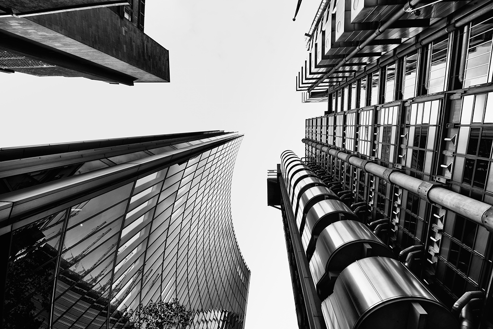 A camera pointed vertically to catch the geometric architecture of the buildings in london