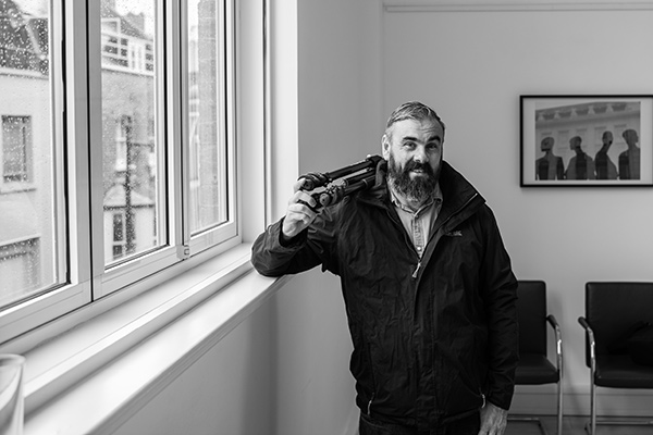 Black and white portrait of camera man in London