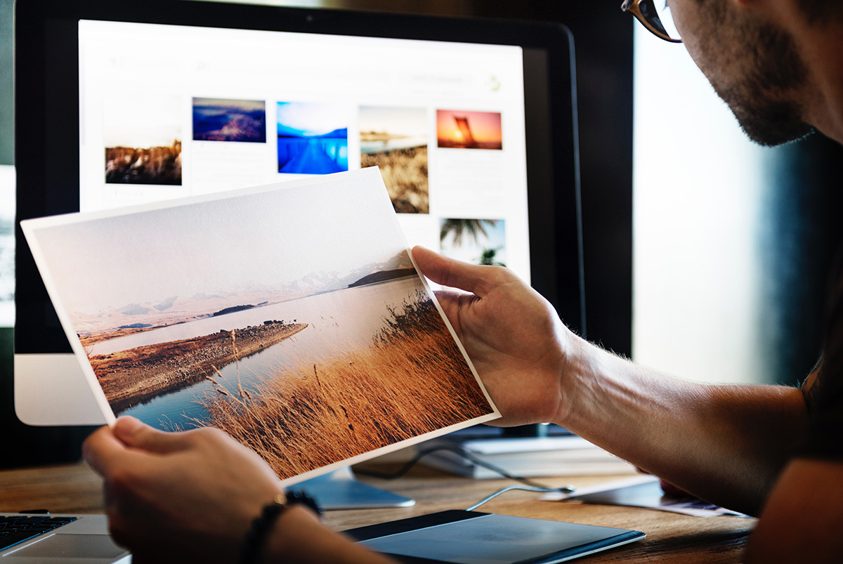 Man looking at photograph