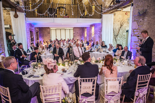 groomsmen gives speech at wedding