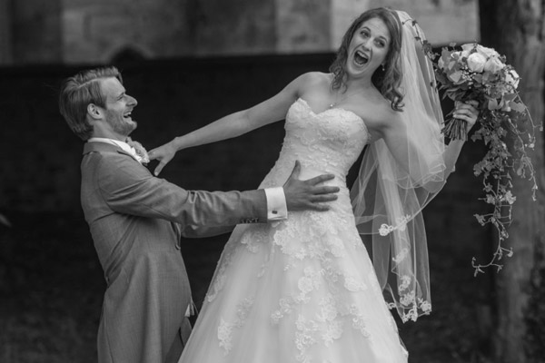 bride and groom take goofy at wedding