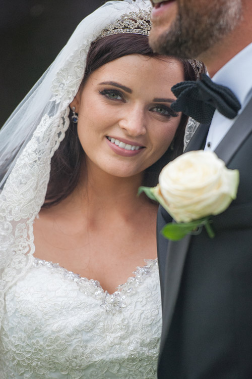 bridal portrait on groom's shoulder