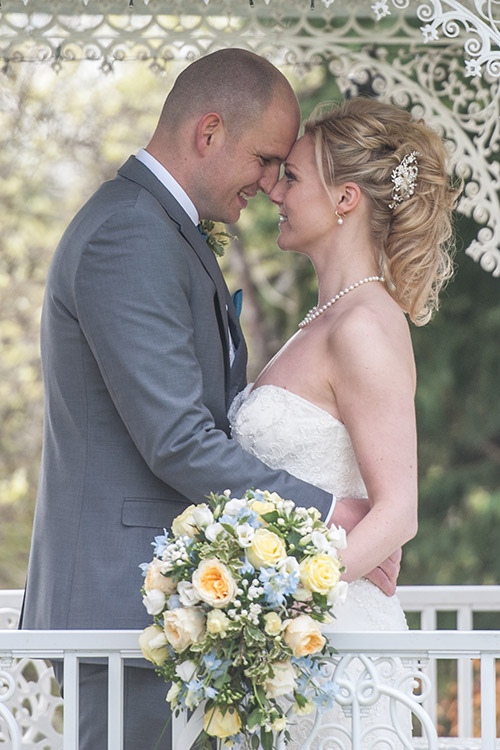 bride and groom photographed in marquee